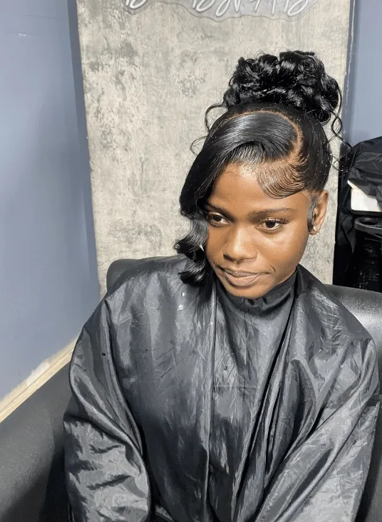 Pin-up updo with curled bang